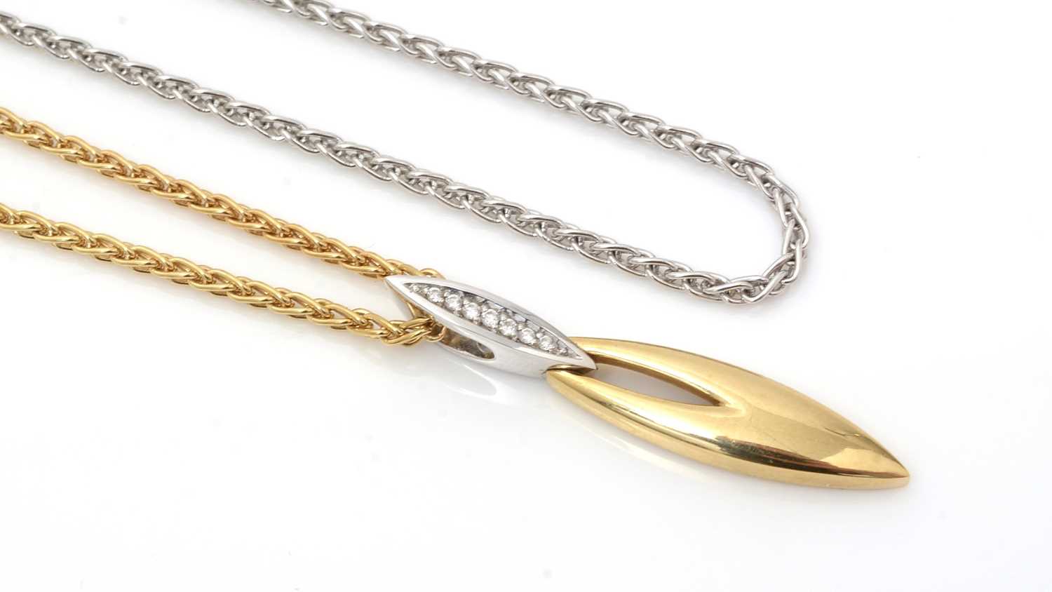 Lot 471 - An 18ct gold and diamond pendant with interchangeable chains