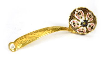 Lot 721 - A Royal Crown Derby 'Old Imari' solid gold band soup ladle