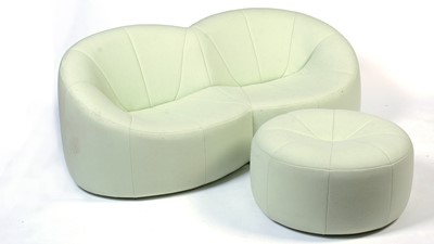 Lot 5 - Ligne Roset: a pumpkin sofa and matching footstool.