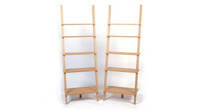 Lot 36 - A pair of modern oak effect graduated book shelves.