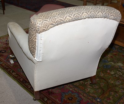 Lot 1350 - An early 20th Century armchair by Howard & Sons.