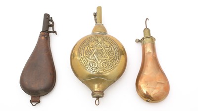 Lot 780 - Three powder flasks.