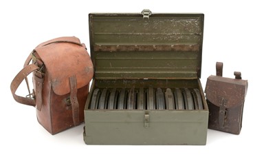 Lot 783 - A magazine tin, leather magazine pouch, and cleaning kit pouch