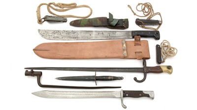 Lot 789 - Three bayonets, a machete, a dagger and three folding knives.
