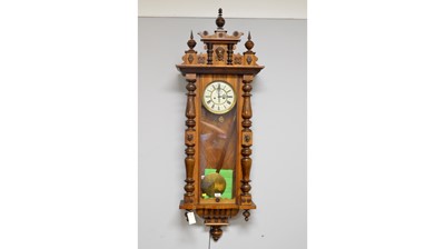 Lot 108 - A Viennese walnut and beechwood wall clock.