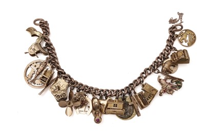 Lot 414 - A gold charm bracelet