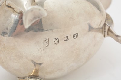 Lot 130 - An early George III silver cream boat.