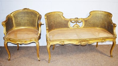 Lot 26 - A Louise XV-style bergere conversation settee; and a similarly styled armchair.