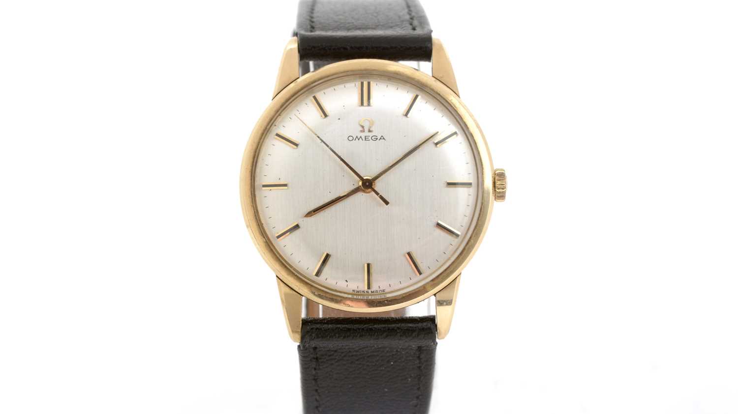 Lot 422 - Omega: a 9ct yellow gold cased manual wind wristwatch, and boxes