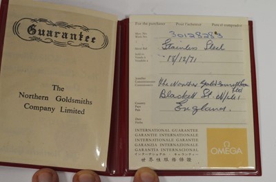 Lot 422 - Omega: a 9ct yellow gold cased manual wind wristwatch, and boxes