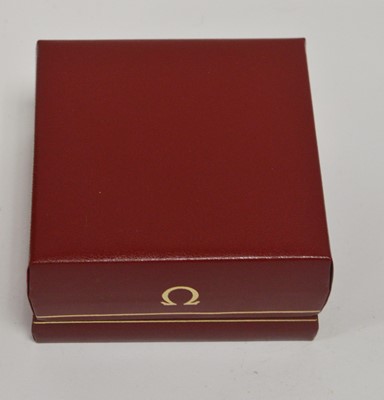Lot 422 - Omega: a 9ct yellow gold cased manual wind wristwatch, and boxes