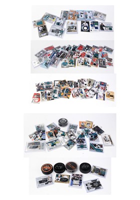 Lot 333 - A selection of Ice hockey trading cards; a puck; and other related items.