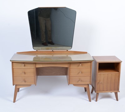 Lot 25 - Alfred Cox for A.C. Furniture: a mid Century teak and walnut bedroom suite.