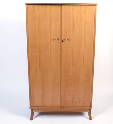 Lot 25 - Alfred Cox for A.C. Furniture: a mid Century teak and walnut bedroom suite.