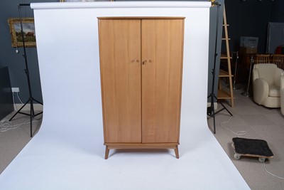 Lot 25 - Alfred Cox for A.C. Furniture: a mid Century teak and walnut bedroom suite.