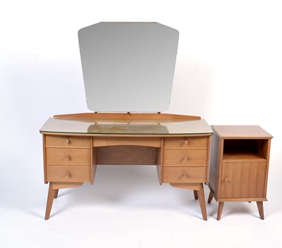 Lot 25 - Alfred Cox for A.C. Furniture: a mid Century teak and walnut bedroom suite.