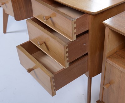 Lot 25 - Alfred Cox for A.C. Furniture: a mid Century teak and walnut bedroom suite.