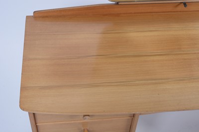 Lot 25 - Alfred Cox for A.C. Furniture: a mid Century teak and walnut bedroom suite.
