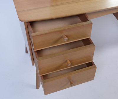 Lot 25 - Alfred Cox for A.C. Furniture: a mid Century teak and walnut bedroom suite.