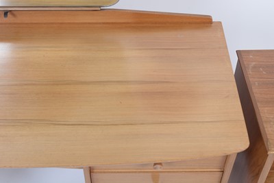 Lot 25 - Alfred Cox for A.C. Furniture: a mid Century teak and walnut bedroom suite.