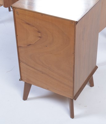 Lot 25 - Alfred Cox for A.C. Furniture: a mid Century teak and walnut bedroom suite.