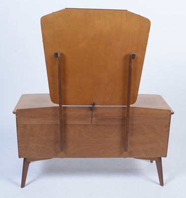 Lot 25 - Alfred Cox for A.C. Furniture: a mid Century teak and walnut bedroom suite.