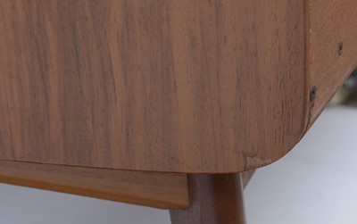 Lot 25 - Alfred Cox for A.C. Furniture: a mid Century teak and walnut bedroom suite.