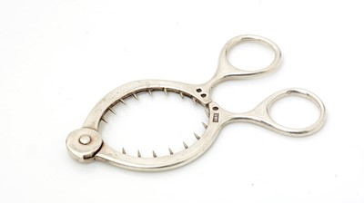 Lot 3 - An Edwardian Scottish silver egg-topper with ring handles.