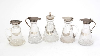 Lot 170 - Five various silver-mounted cut glass whisky tots/chota pegs; and five various labels.
