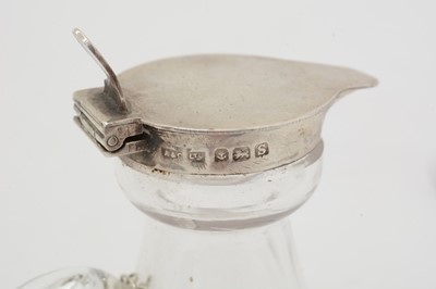 Lot 170 - Five various silver-mounted cut glass whisky tots/chota pegs; and five various labels.