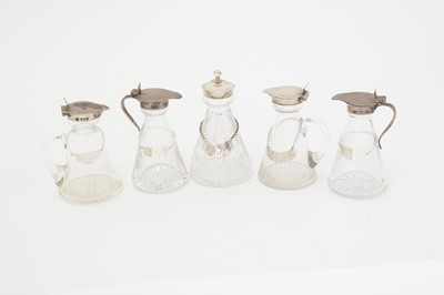 Lot 170 - Five various silver-mounted cut glass whisky tots/chota pegs; and five various labels.