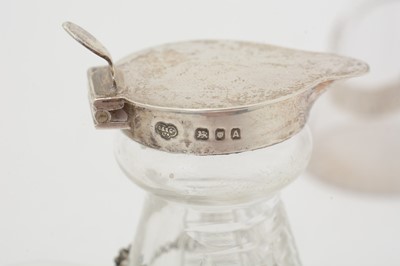 Lot 170 - Five various silver-mounted cut glass whisky tots/chota pegs; and five various labels.