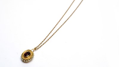 Lot 186 - A garnet and seed pearl pendant