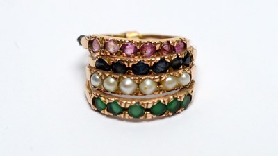Lot 190 - A four band gem set ring