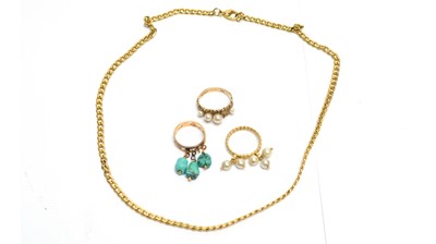Lot 194 - Two tasse rings, another ring and a gilt metal chain.