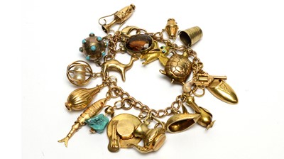 Lot 195 - A 9ct yellow gold charm bracelet