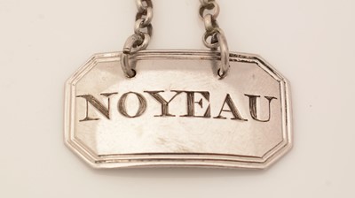 Lot 264 - A George III small silver wine label.