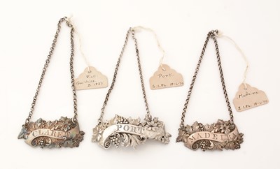 Lot 239 - A matched pair of Victorian silver wine labels; and another similar label.