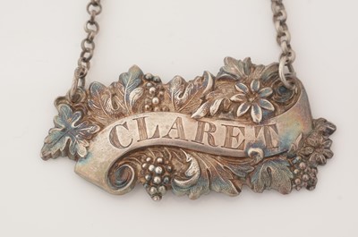 Lot 239 - A matched pair of Victorian silver wine labels; and another similar label.