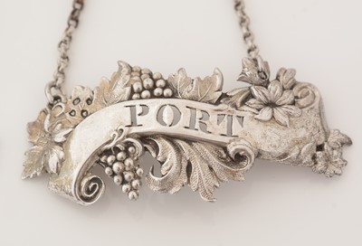 Lot 239 - A matched pair of Victorian silver wine labels; and another similar label.