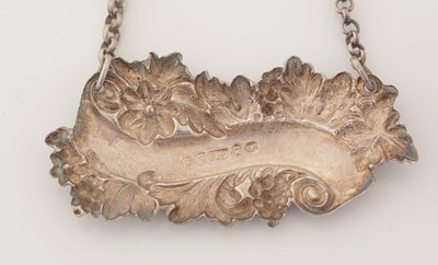 Lot 239 - A matched pair of Victorian silver wine labels; and another similar label.