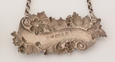 Lot 239 - A matched pair of Victorian silver wine labels; and another similar label.