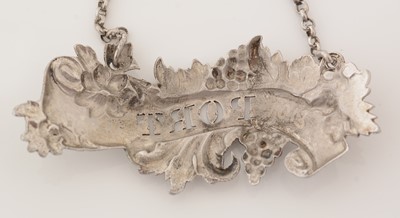 Lot 239 - A matched pair of Victorian silver wine labels; and another similar label.