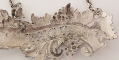 Lot 239 - A matched pair of Victorian silver wine labels; and another similar label.