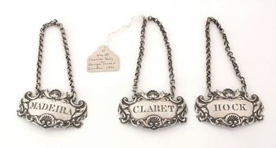 Lot 228 - A set of three William IV silver wine labels.