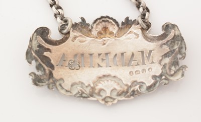 Lot 228 - A set of three William IV silver wine labels.