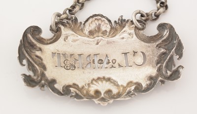 Lot 228 - A set of three William IV silver wine labels.