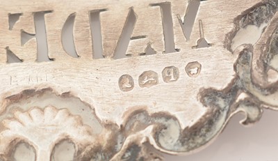 Lot 228 - A set of three William IV silver wine labels.
