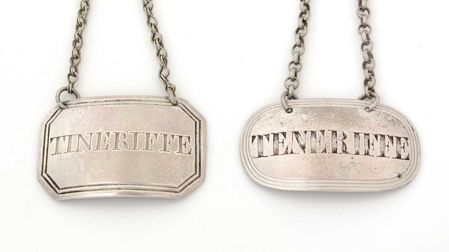 Lot 231 - A George III silver wine label; and another.