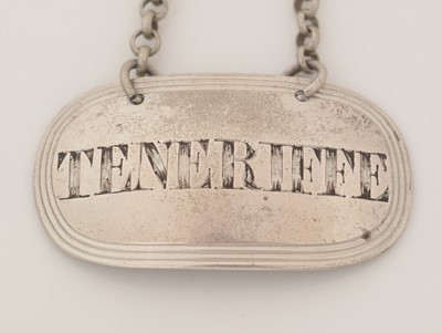 Lot 231 - A George III silver wine label; and another.